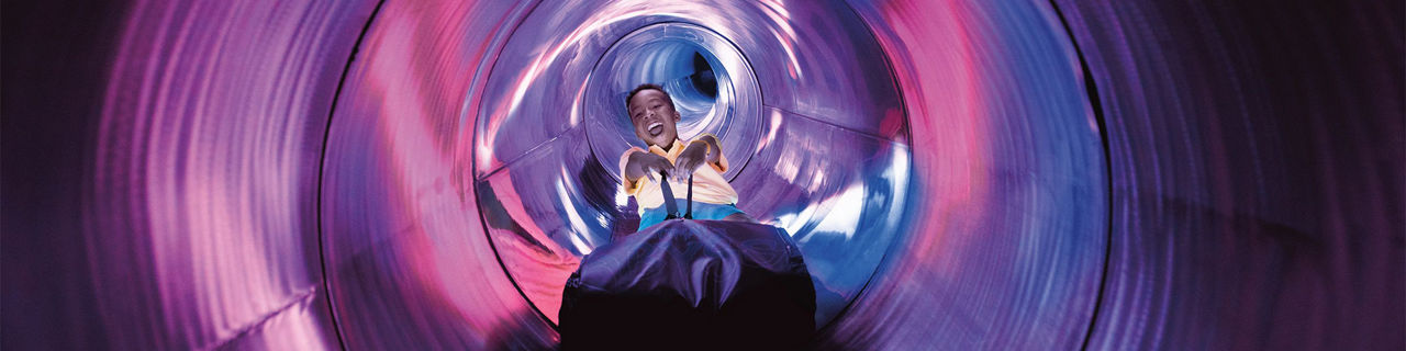 Young Man Sliding Down Ultimate Abyss