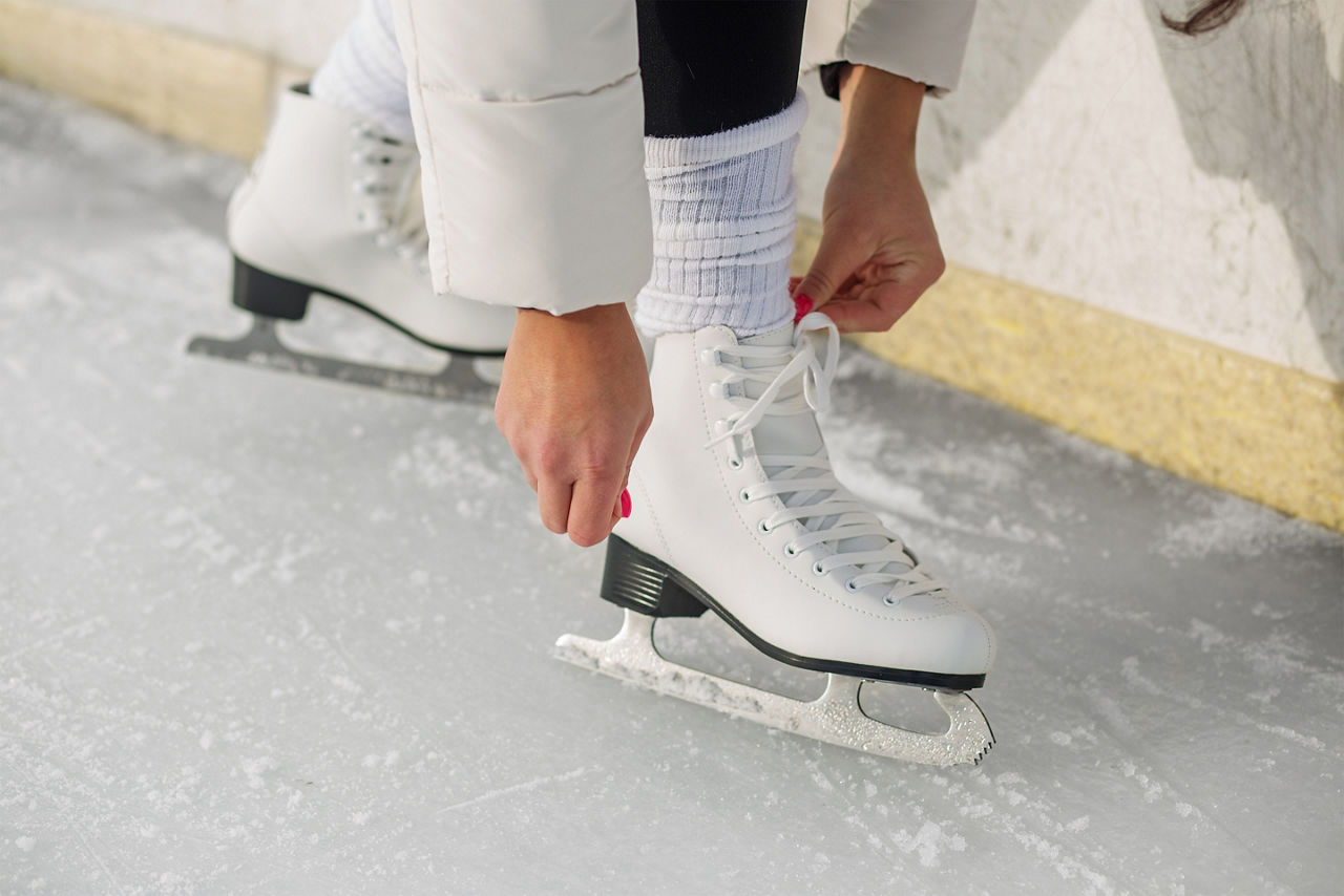 Woman lacing figure skates