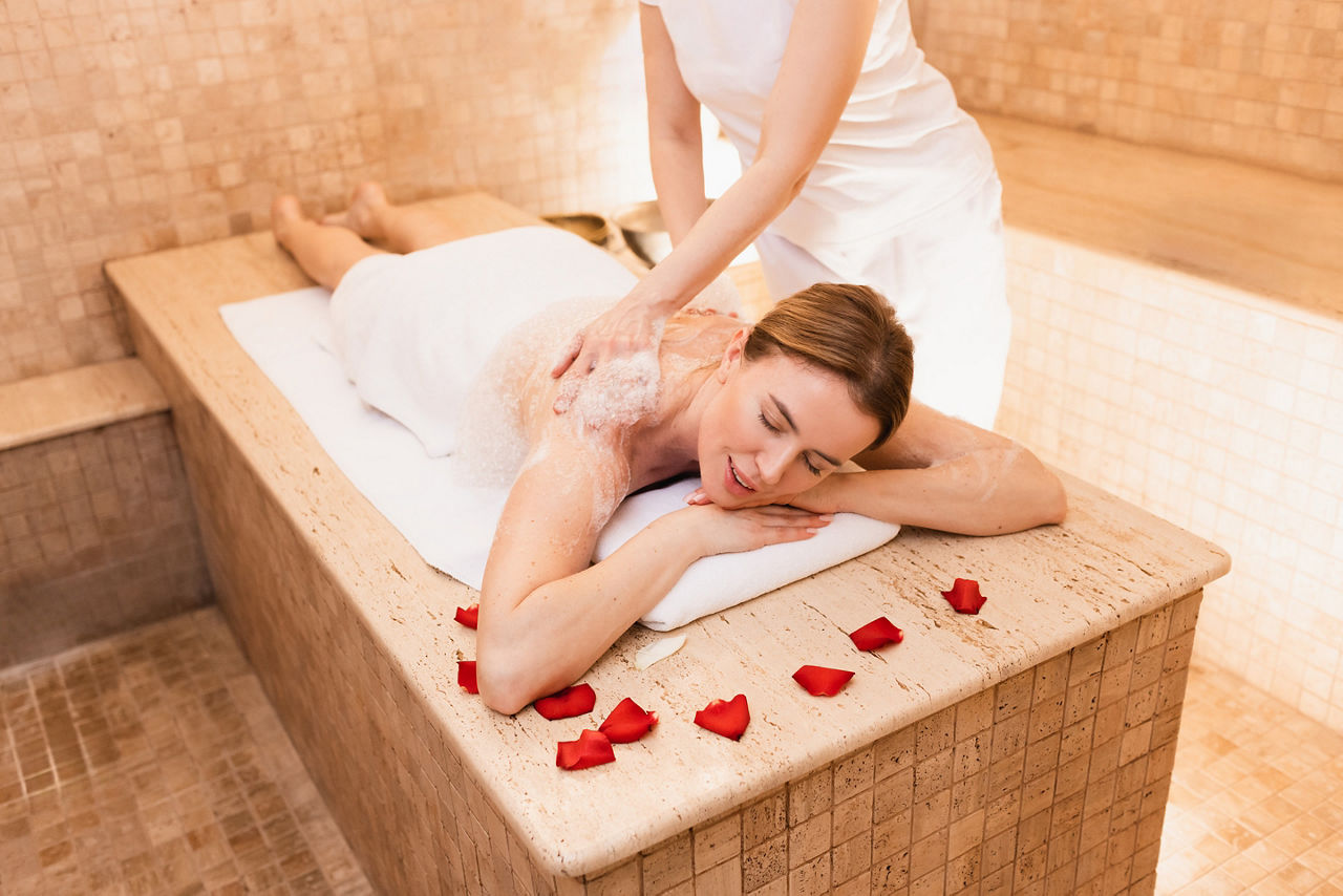Woman resting in hammam or public Turkish bath