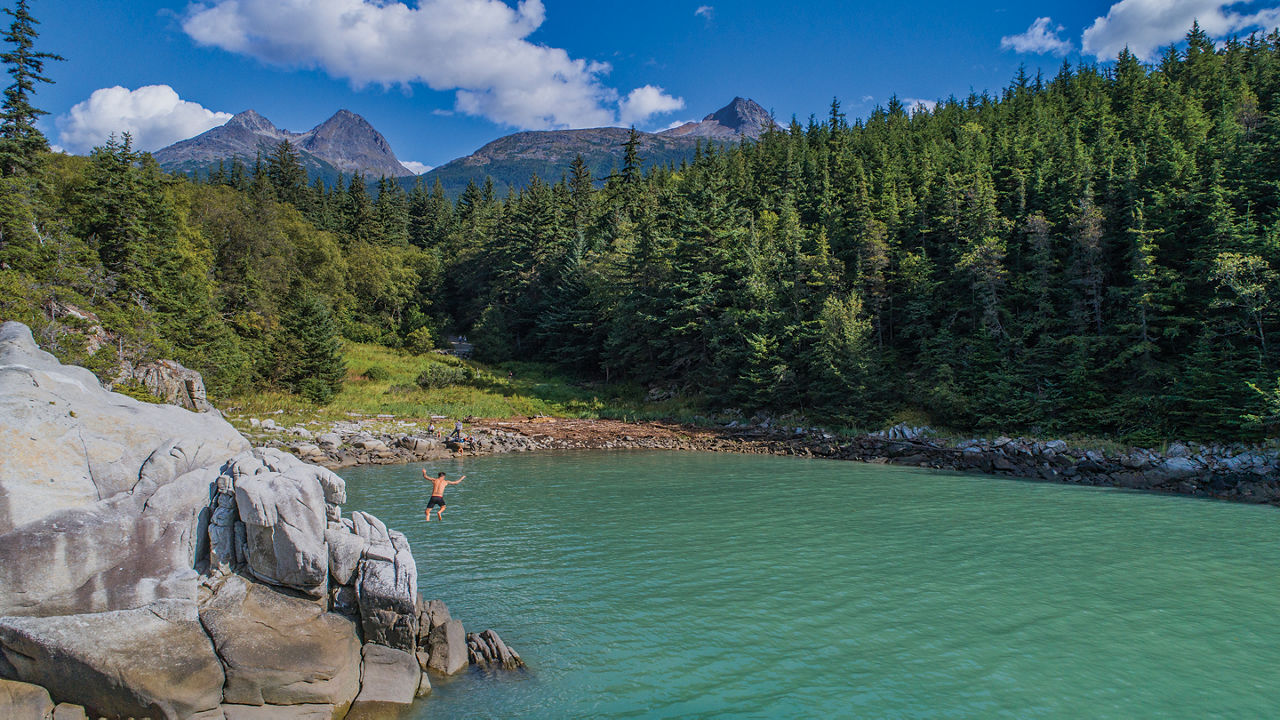 alaska skagway man jumping off cliff