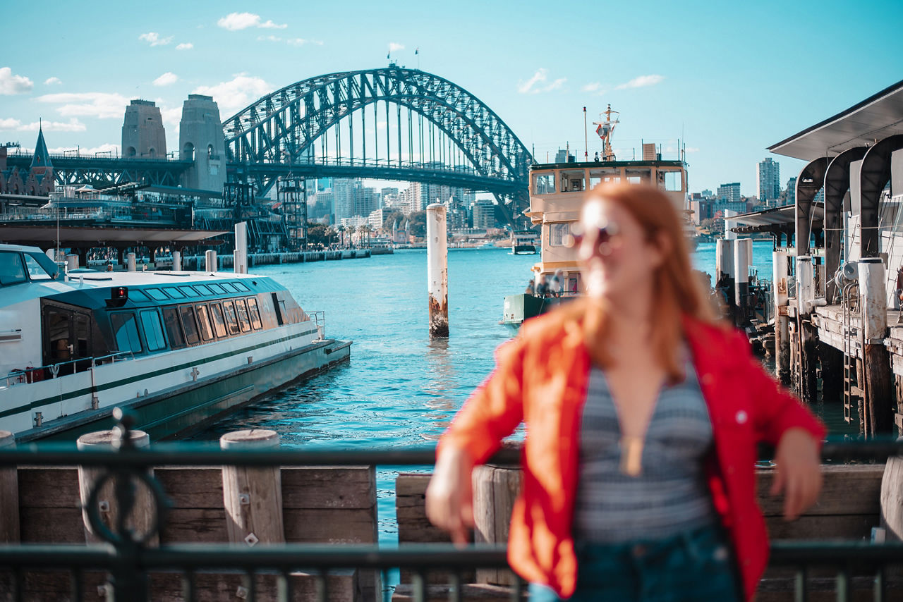 Girl in Sydney with the harbour bridge in the background. 