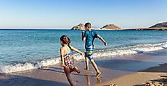 Kids Playing Running at the Beach