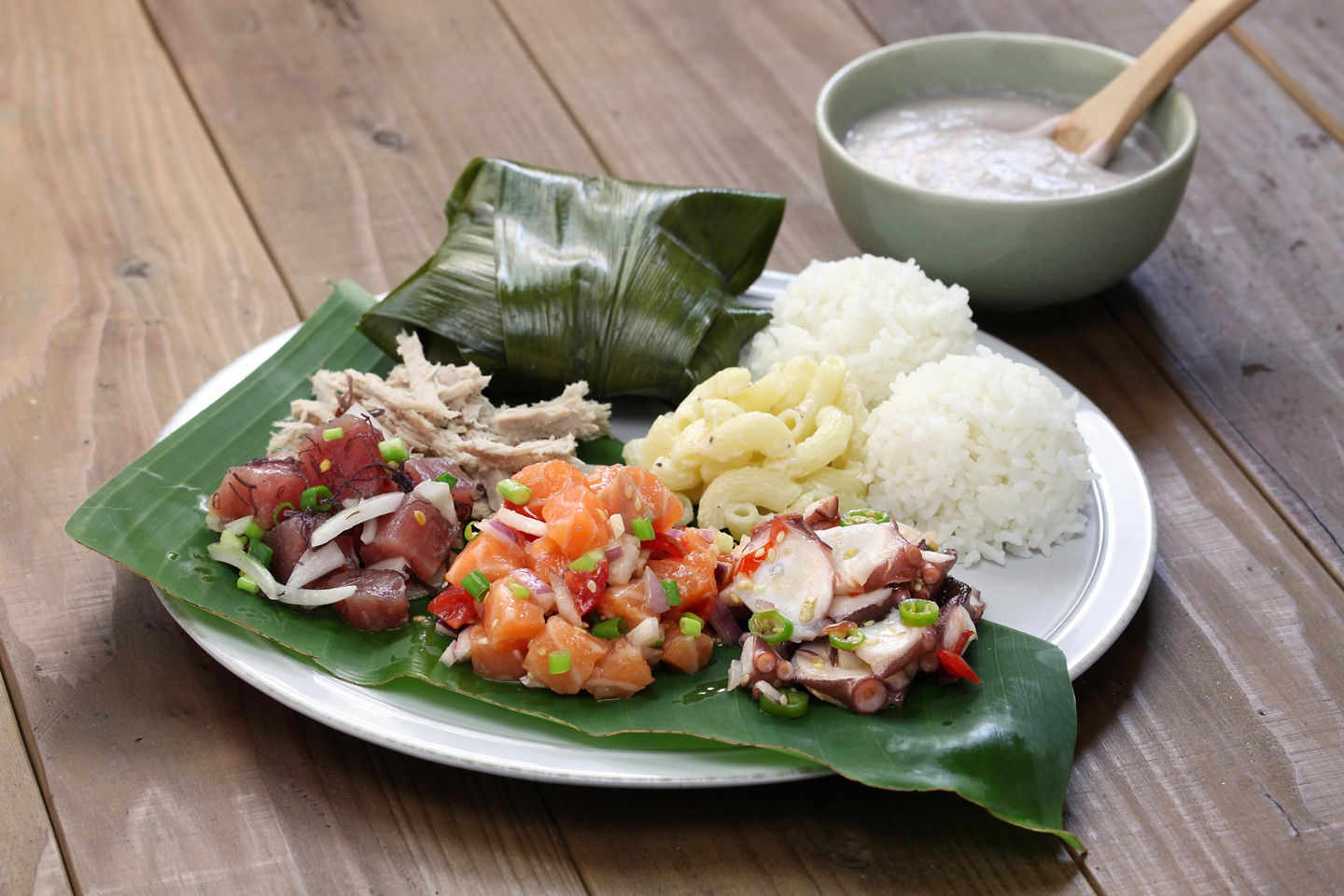 Polynesian‑style pork rests beside rice and greens, showcasing tender textures and bold island flavors. - Hawaii