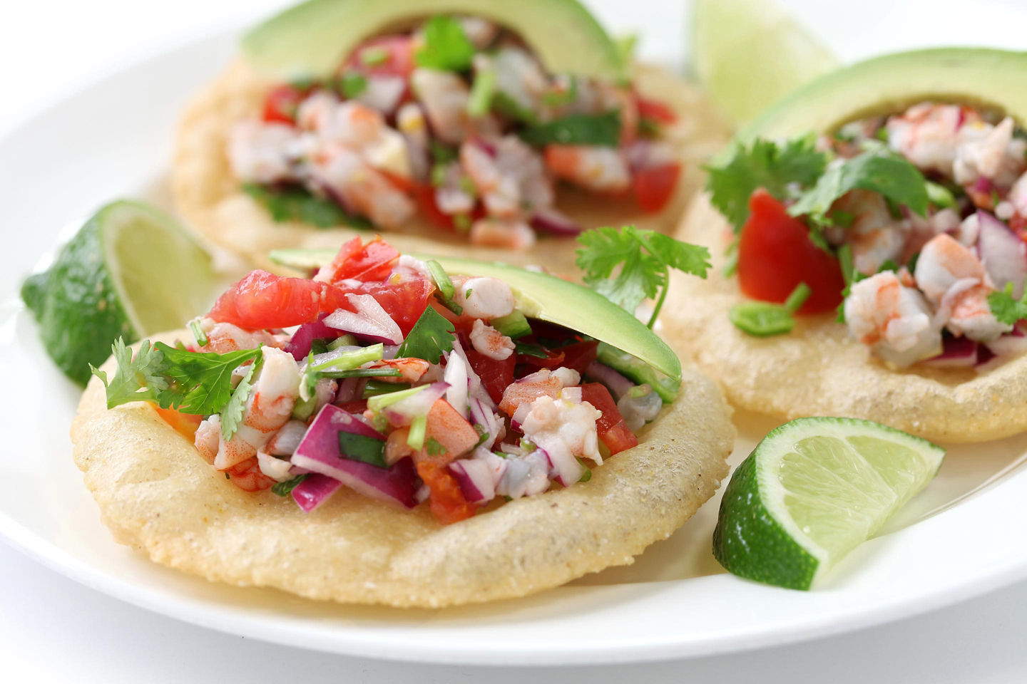 Shrimp tacos sit topped with fresh garnish, highlighting Cozumel’s coastal flavors. - Cozumel, Mexico