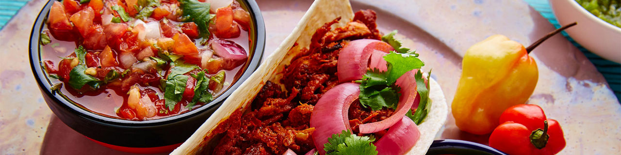 Mexican Conchinita Pibil Taco with Lime and Pico de Gallo