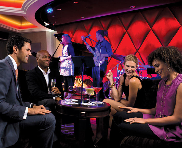 Group of co-workers in a cruise nightclub during a corporate event.