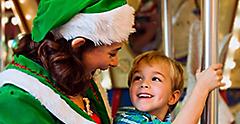 Christmas Elf Riding on the Carousel with a Little Kid