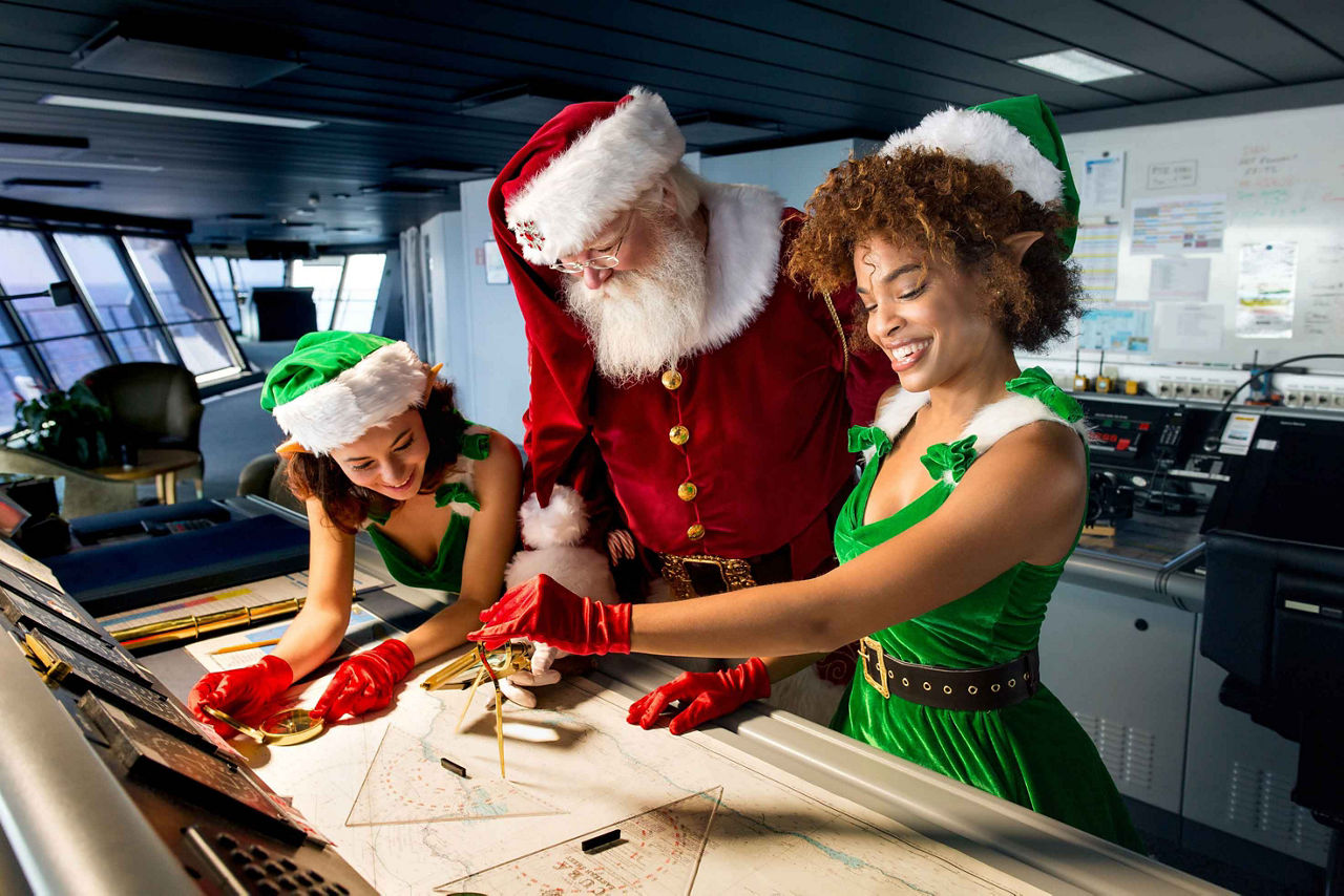 Santa and Two Christmas Elves at Work During Holiday Cruise