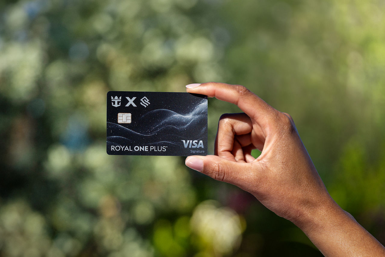 Hand holding Royal ONE Plus Card 