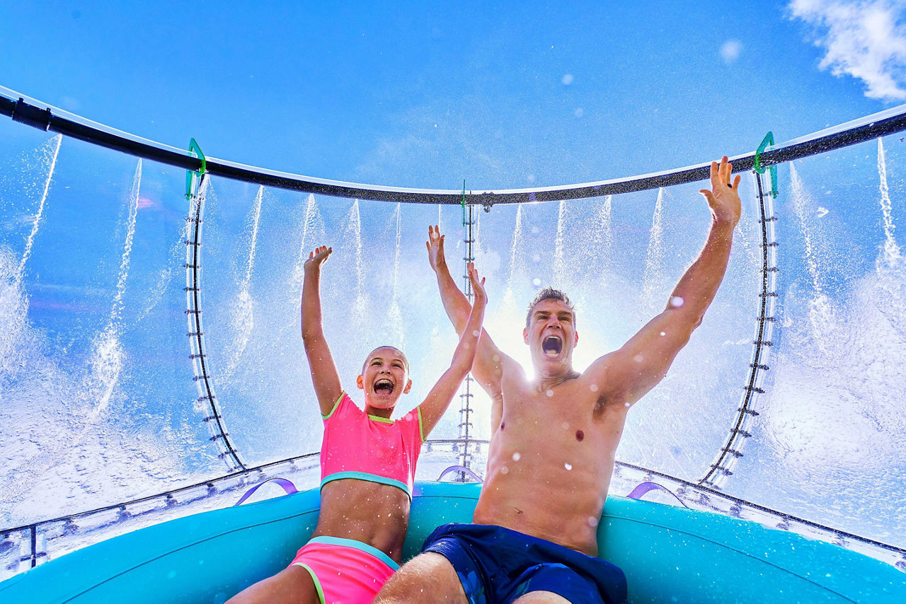Father and daughter riding the Storm Surge in Category 6 water park