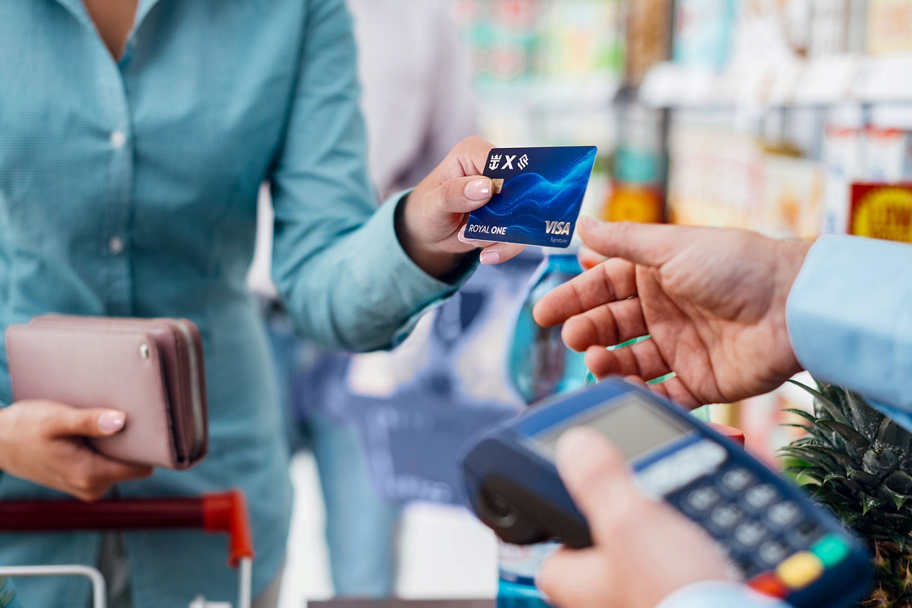 Customer paying using Royal ONE card for groceries