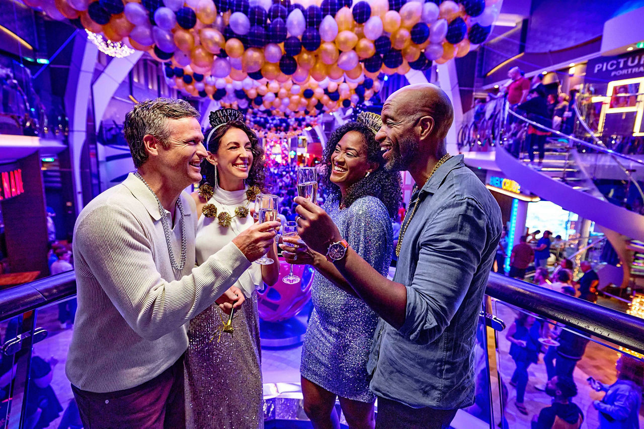 Two couples celebrating New Year's Eve on Rising Tide Bar 