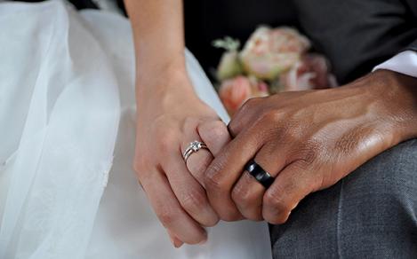 Just Married Interracial Couple Holding Hands Wearing Wedding Rings