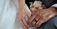 Just Married Interracial Couple Holding Hands Wearing Wedding Rings