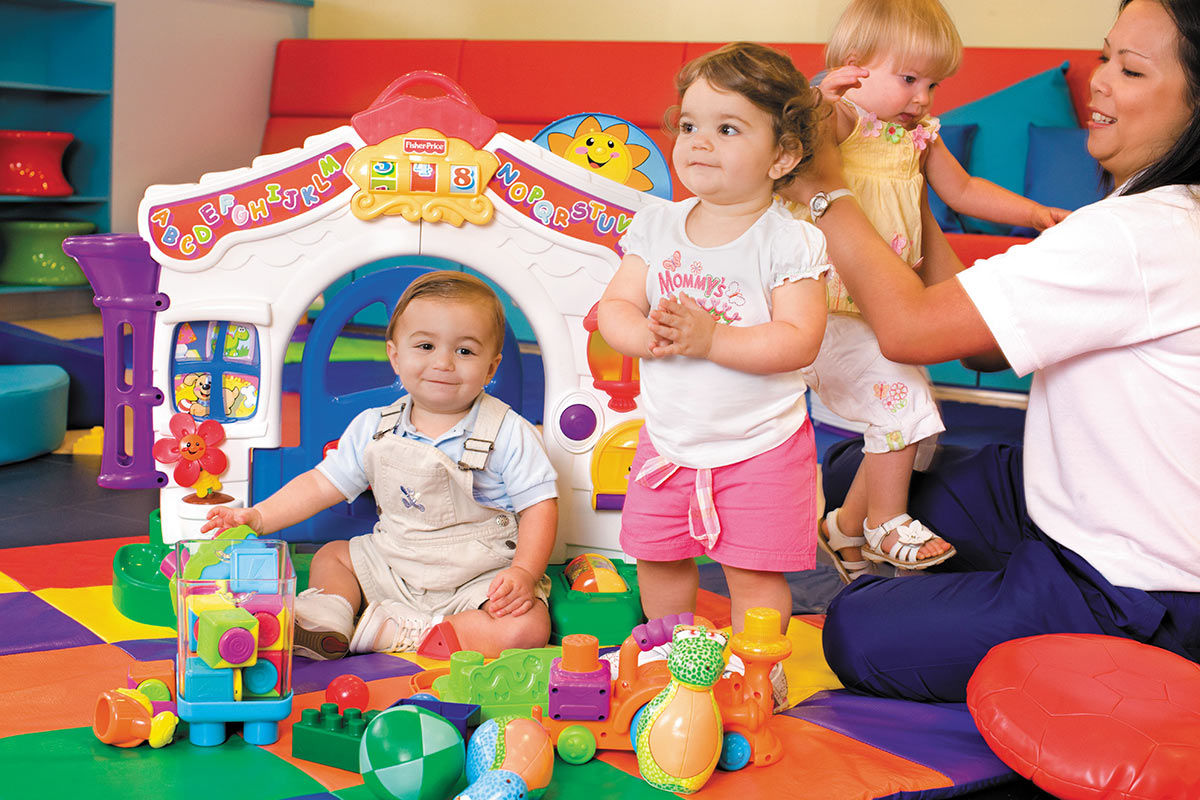 Toddlers in a playroom with the best cruise sitters and nursery services.