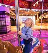 Young Boy Enjoying the Carousel 