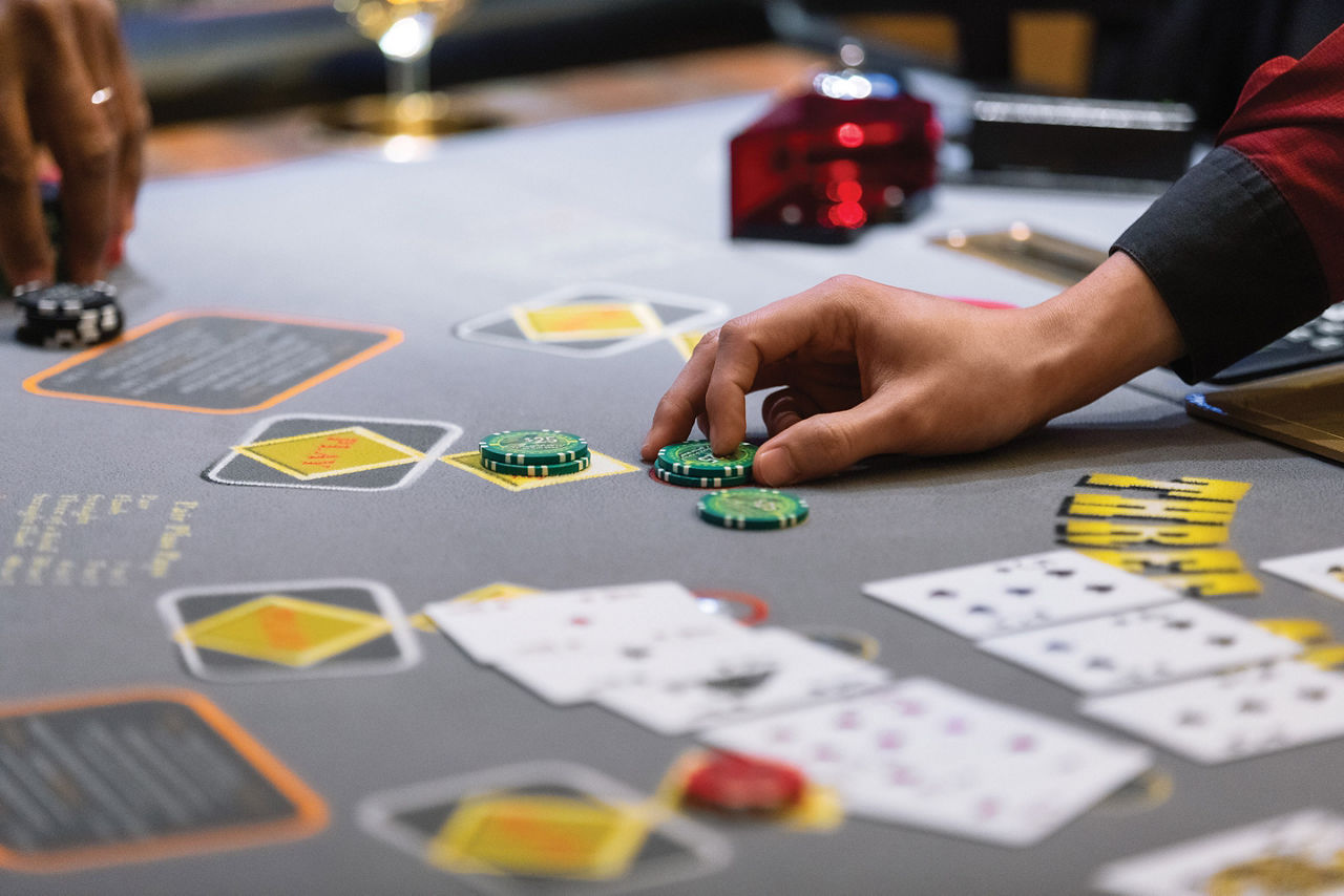 Navigator of the Seas Casino Dealer Placing Bets Chips