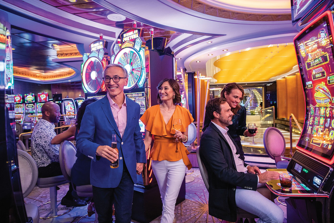 Navigator of the Seas Couples Enjoying Cocktails by the Slots Machine