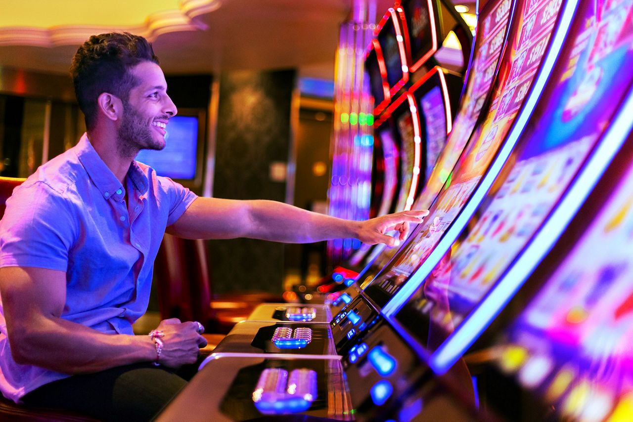 Man Enjoying the Casino Machines on Harmony of the Seas