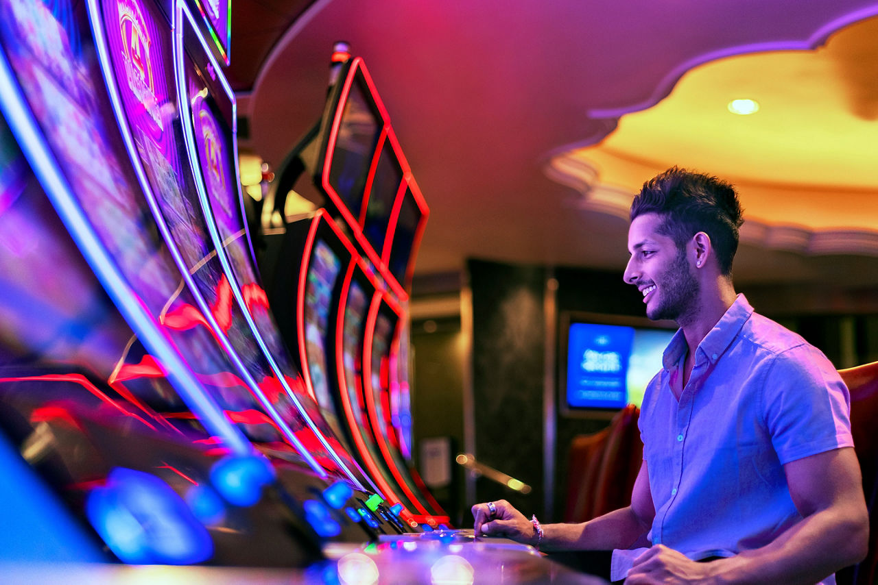 Man Playing Reel Slots