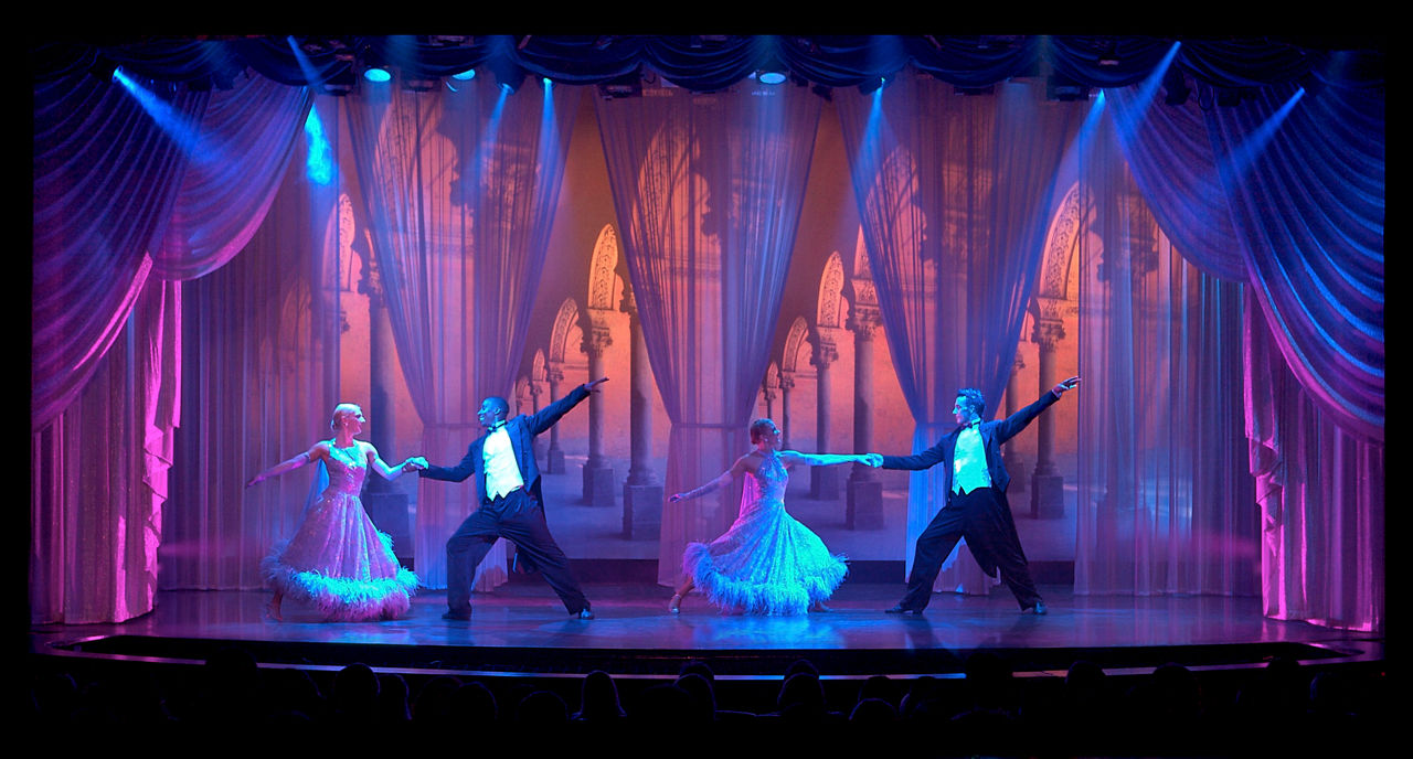 Performers dancing on stage during the Ballroom Fever Cruise Show on Navigator of the Seas