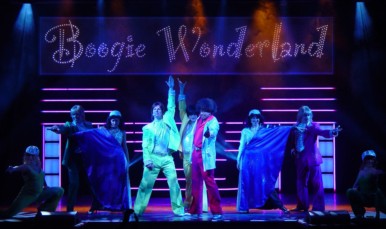 The performance crew of the Boogie Wonderland Cruise Show on stage in Majesty of the Seas