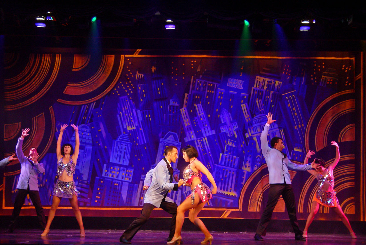 Dancers on stage during Rhythm and Rhyme Cruise Show on Grandeur of the Seas