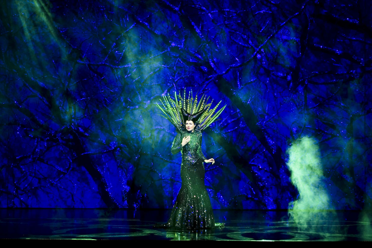Freedom of the Once Upon a Time Cruise Show, Performer Dressed in Green in Fantasy Like Stage