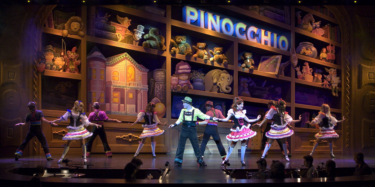 Freedom of the Once Upon a Time Cruise Show, Performers  in dresses dancing on Pinocchio stage