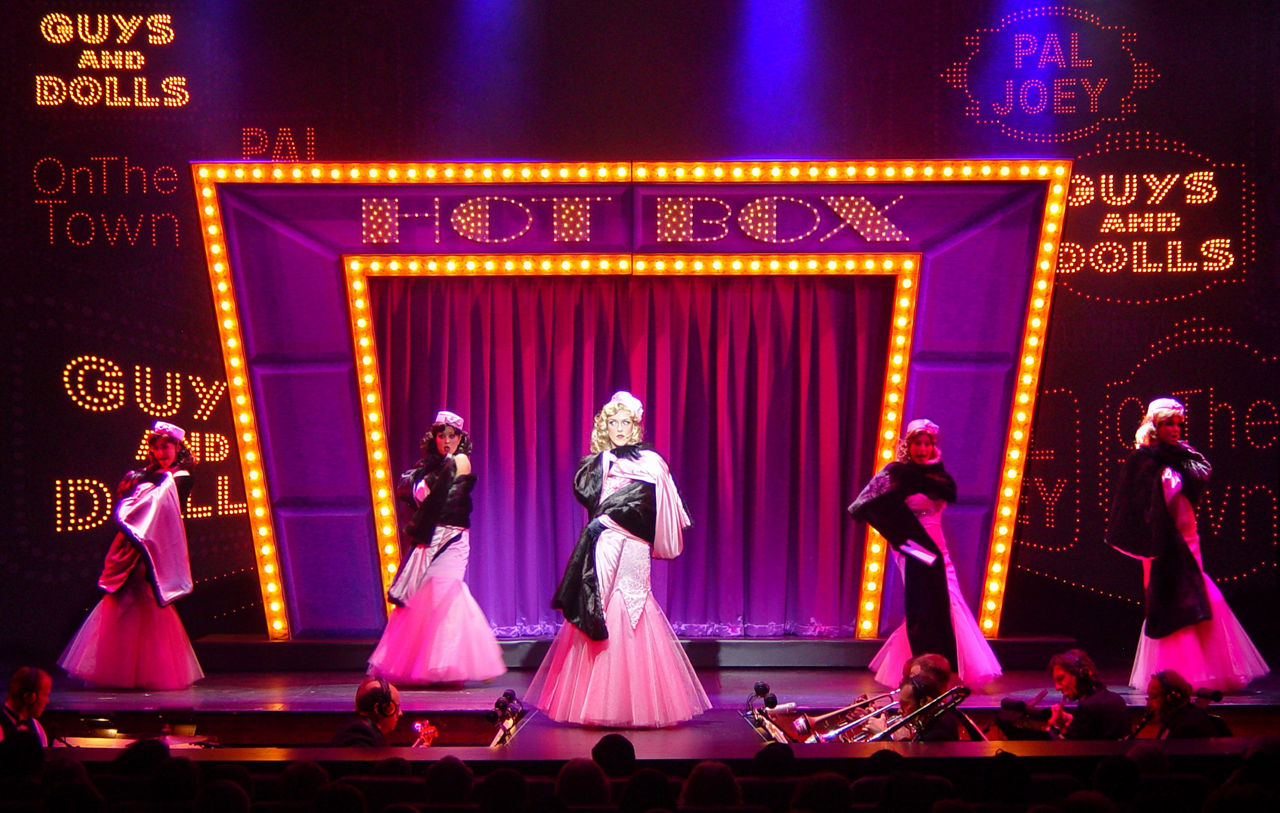 Wild, Cool & Swingin Cruise Show Performers on Stage in Pink dresses Explorer of the Seas