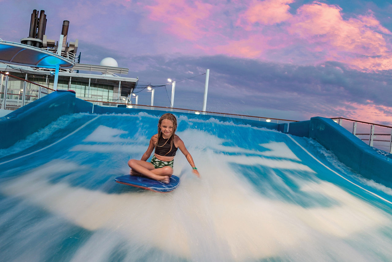 Allure of the Seas Sunset Girl Body Surfing