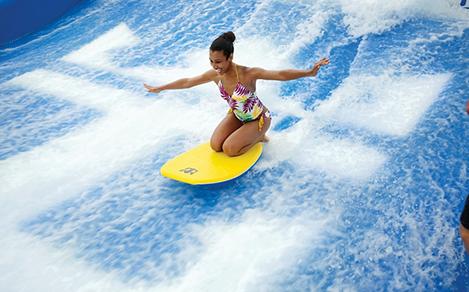 Young Woman Body Surfing Flowrider