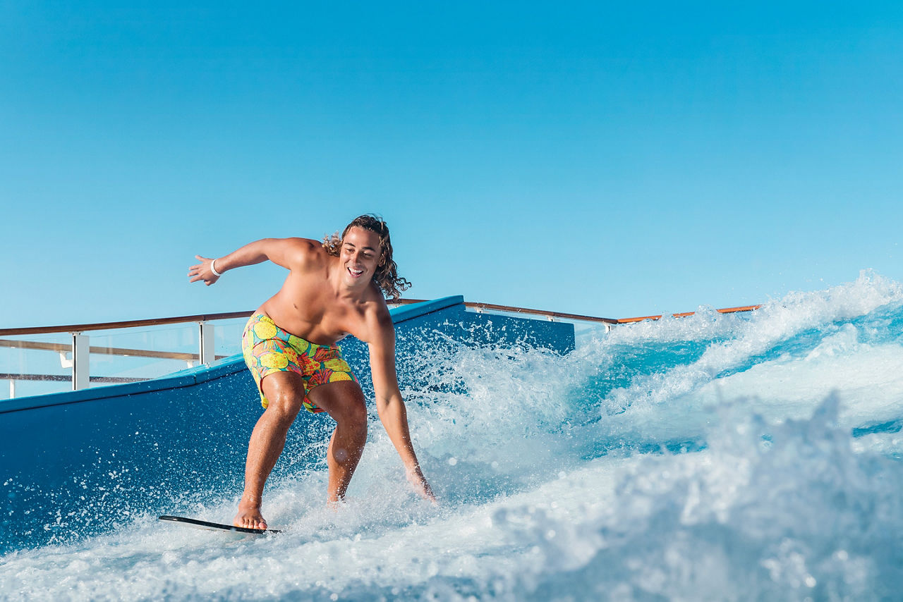 Man Surfing and Splashing on the Flowrider