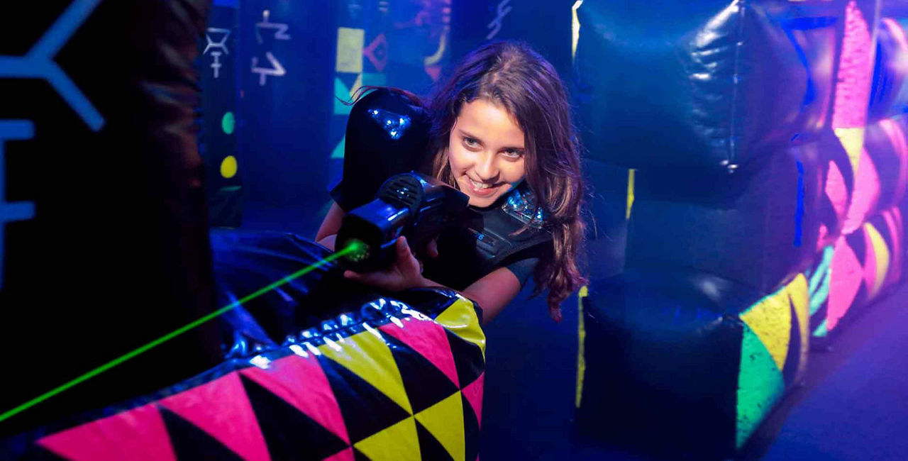 Girl Playing Laser Tag Onboard
