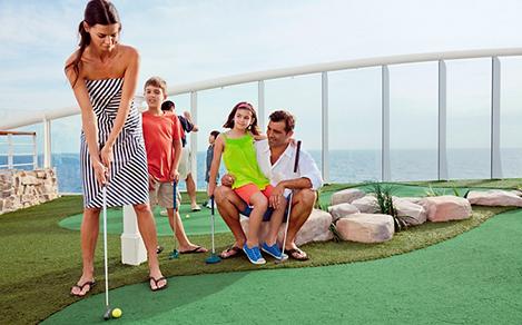 Family Playing Mini Golf Onboard