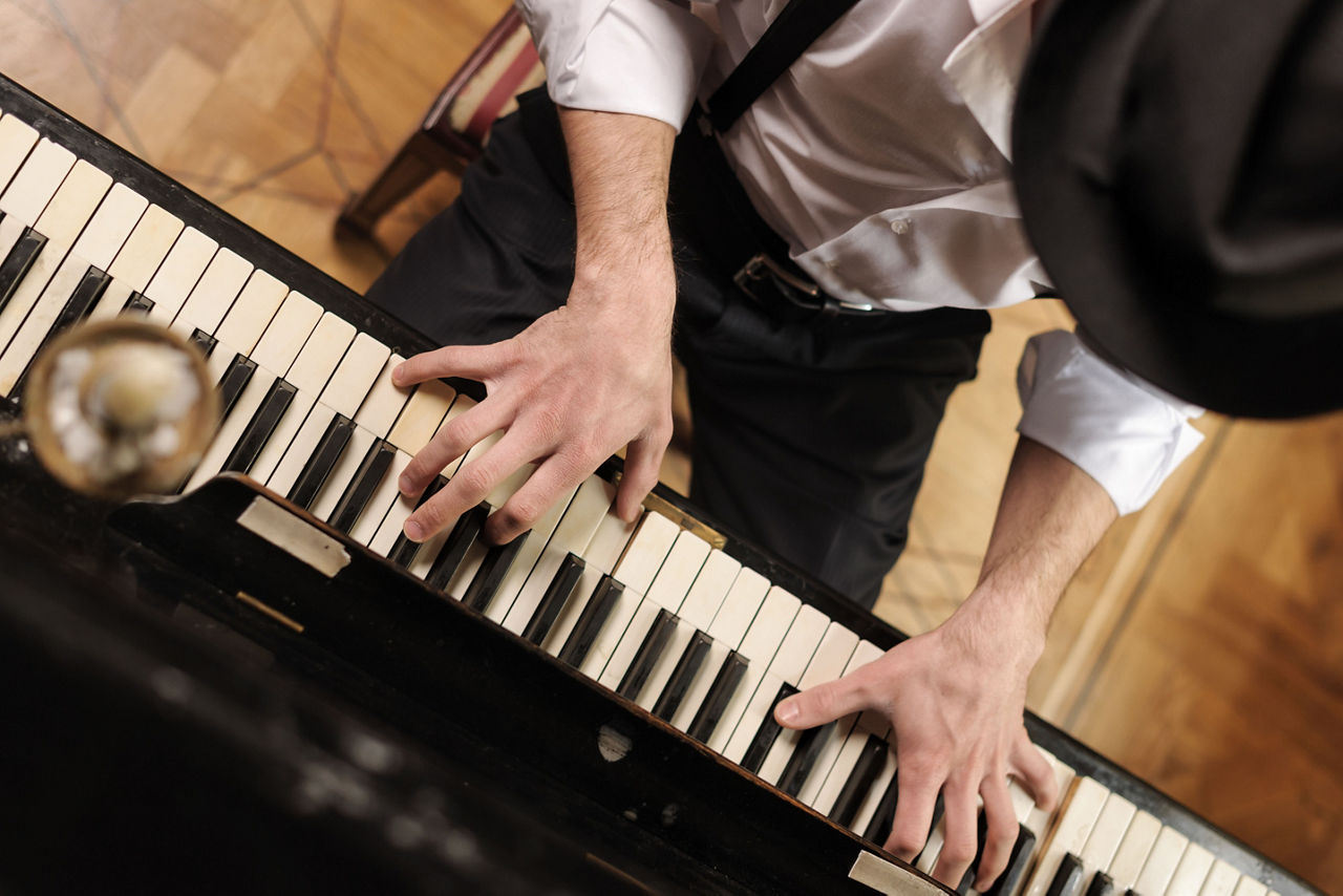 Close-Up of the Piano Player Performing 