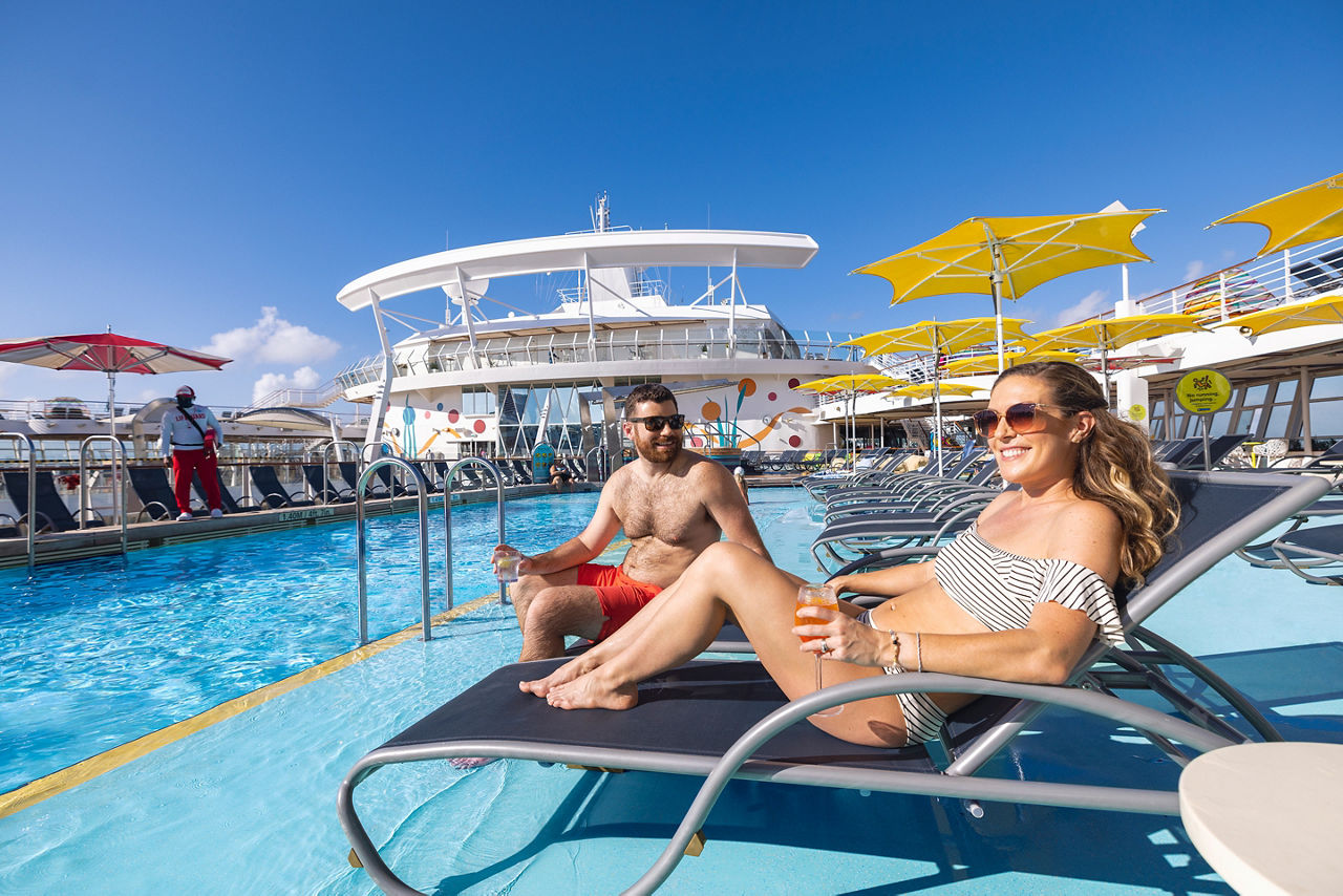 Couple Enjoying a Cocktail and Tanning