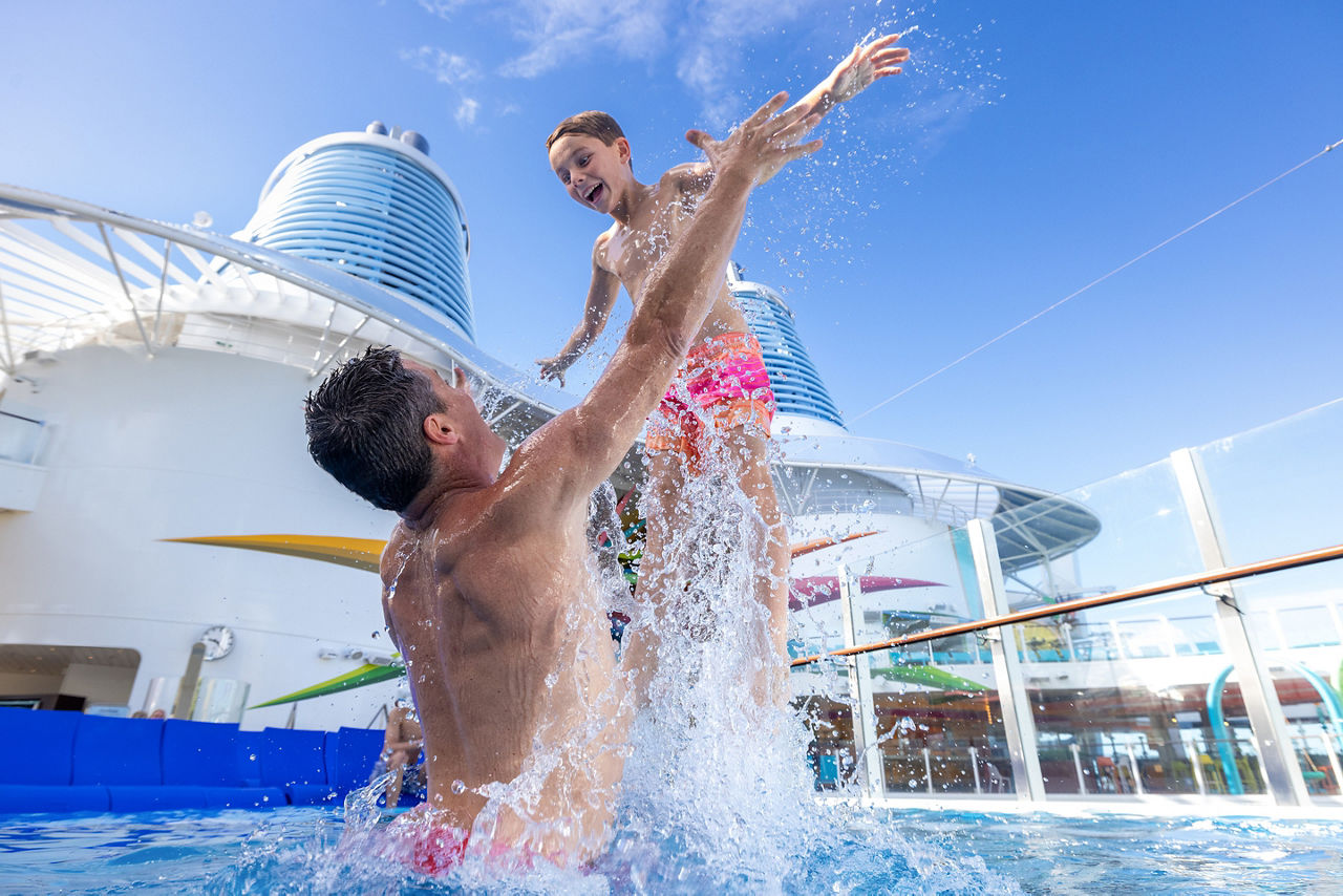 Father Splashing and Swimming at the Royal Bay Pool