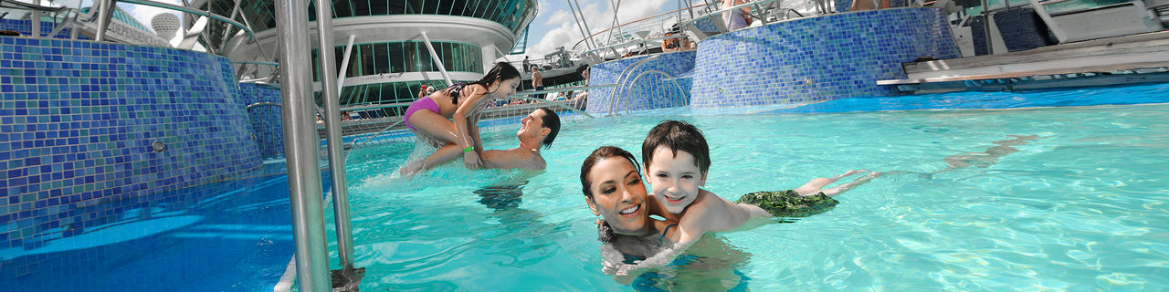 Couple with their Kids in the Pool 