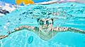 Pool Boy Swimming Underwater