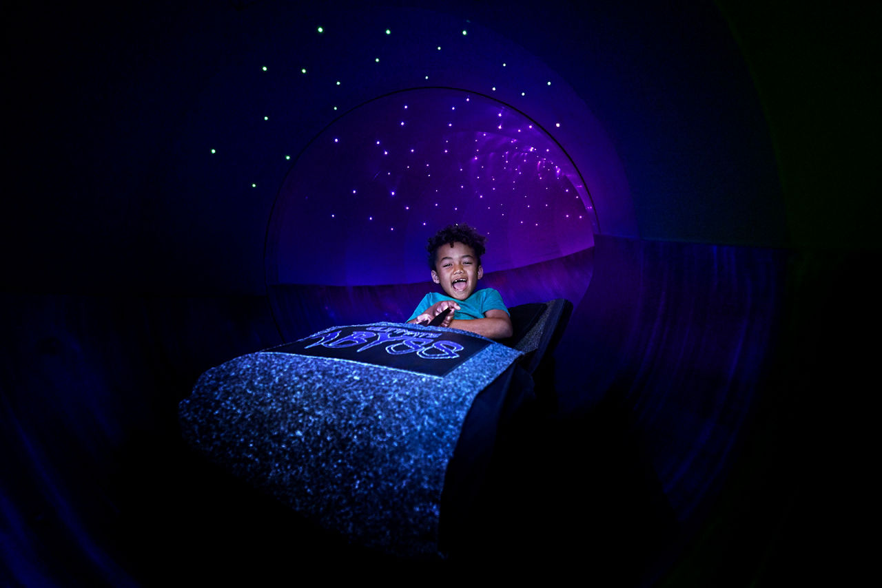 The Ultimate Abyss Boy Going down the Slide