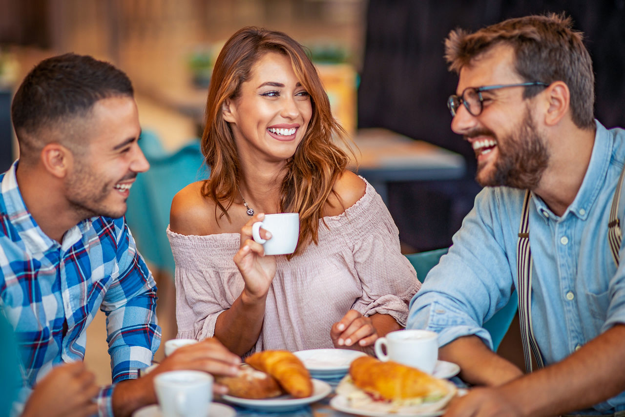 Park Cafe Friends Enjoying Coffee and Pastries
