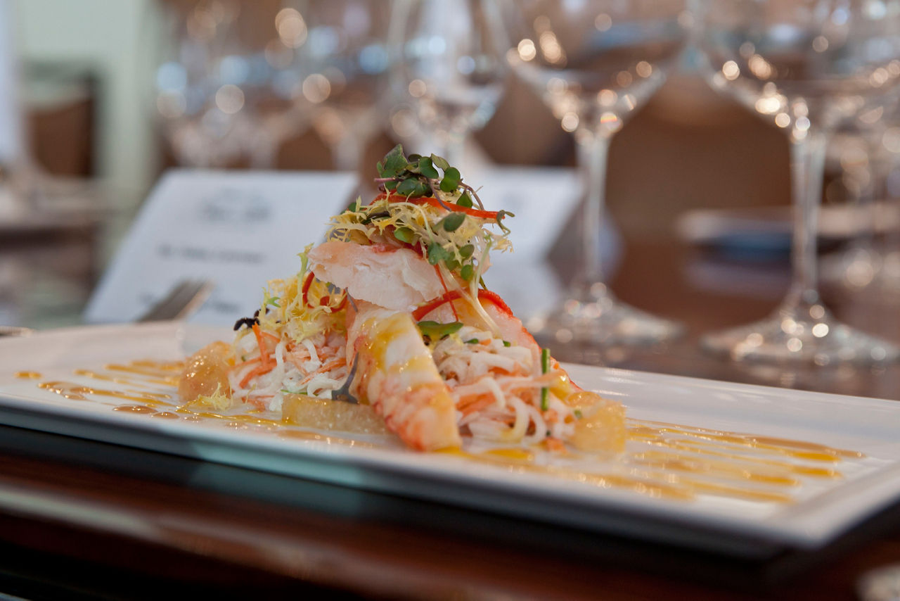 Lobster & Alaska king crab main entree, served at the Elegant Chefs Table restaurant. One of the best cruise line fine dining