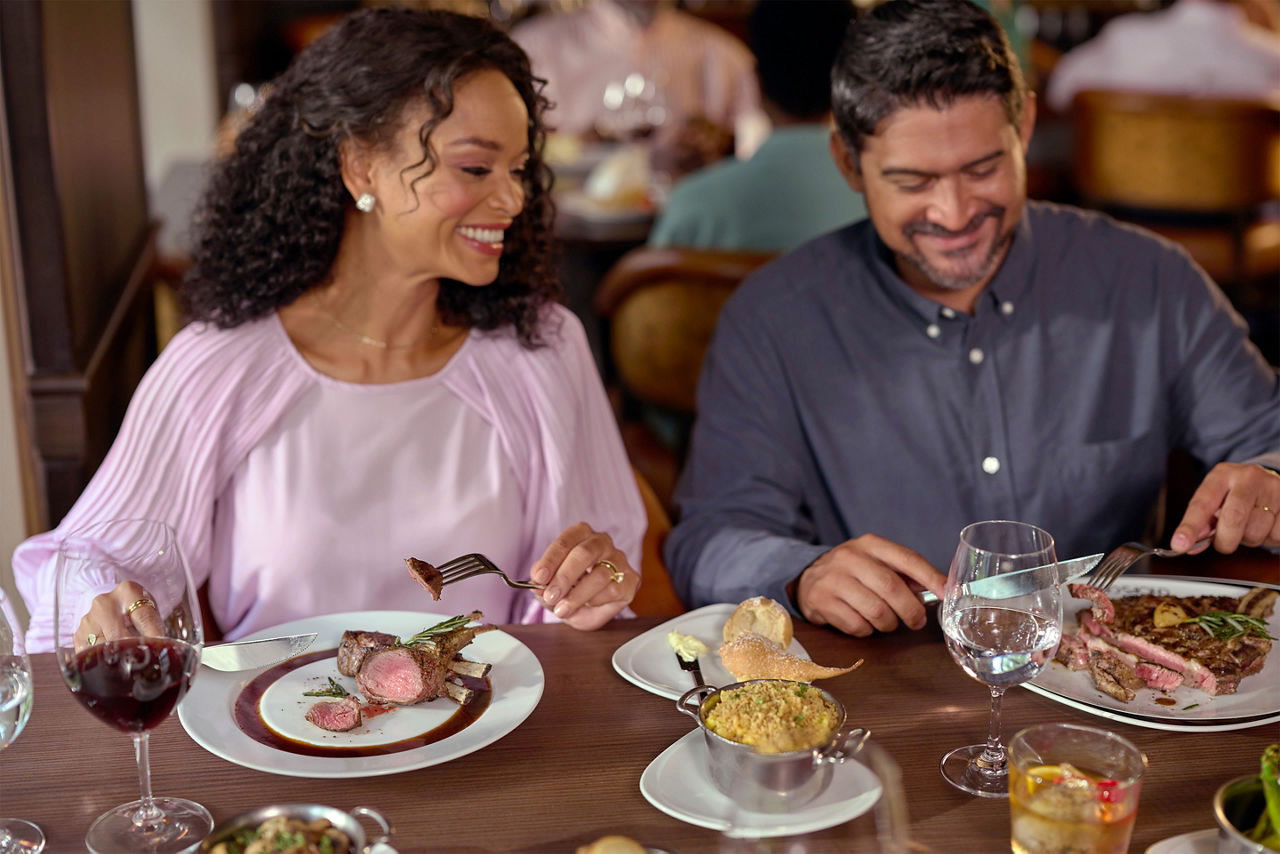 Couple having steak at Chops Grille