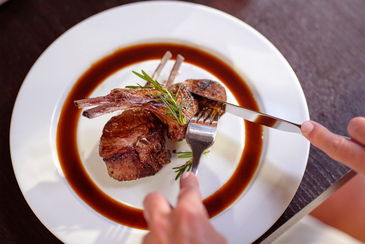 Cutting into Chops Grille dish