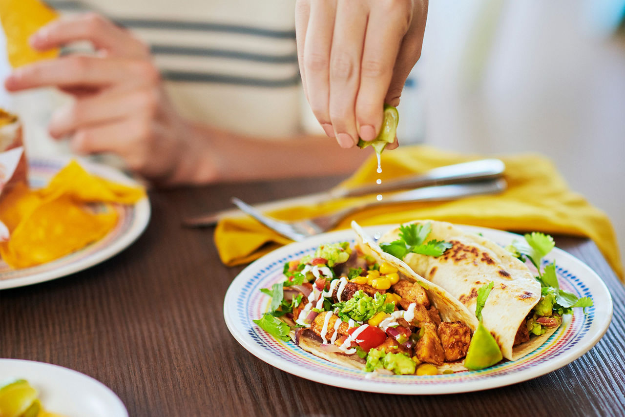 Squeezing lime on soft taco at El Loco Fresh