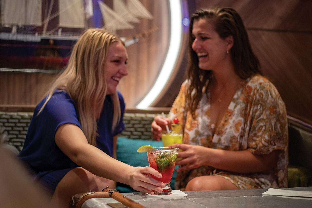 Schooner Bar Friends Enjoying Cocktails and Music