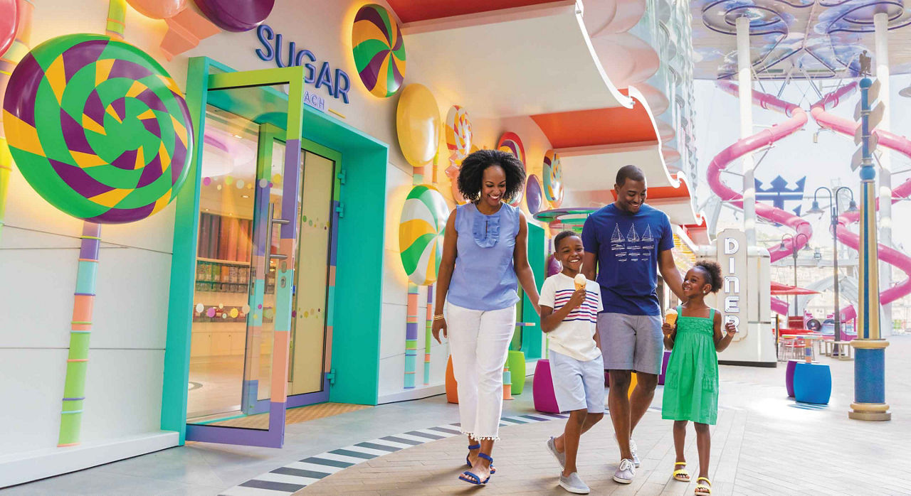 A happy family entering Sugar Beach Candy Store 