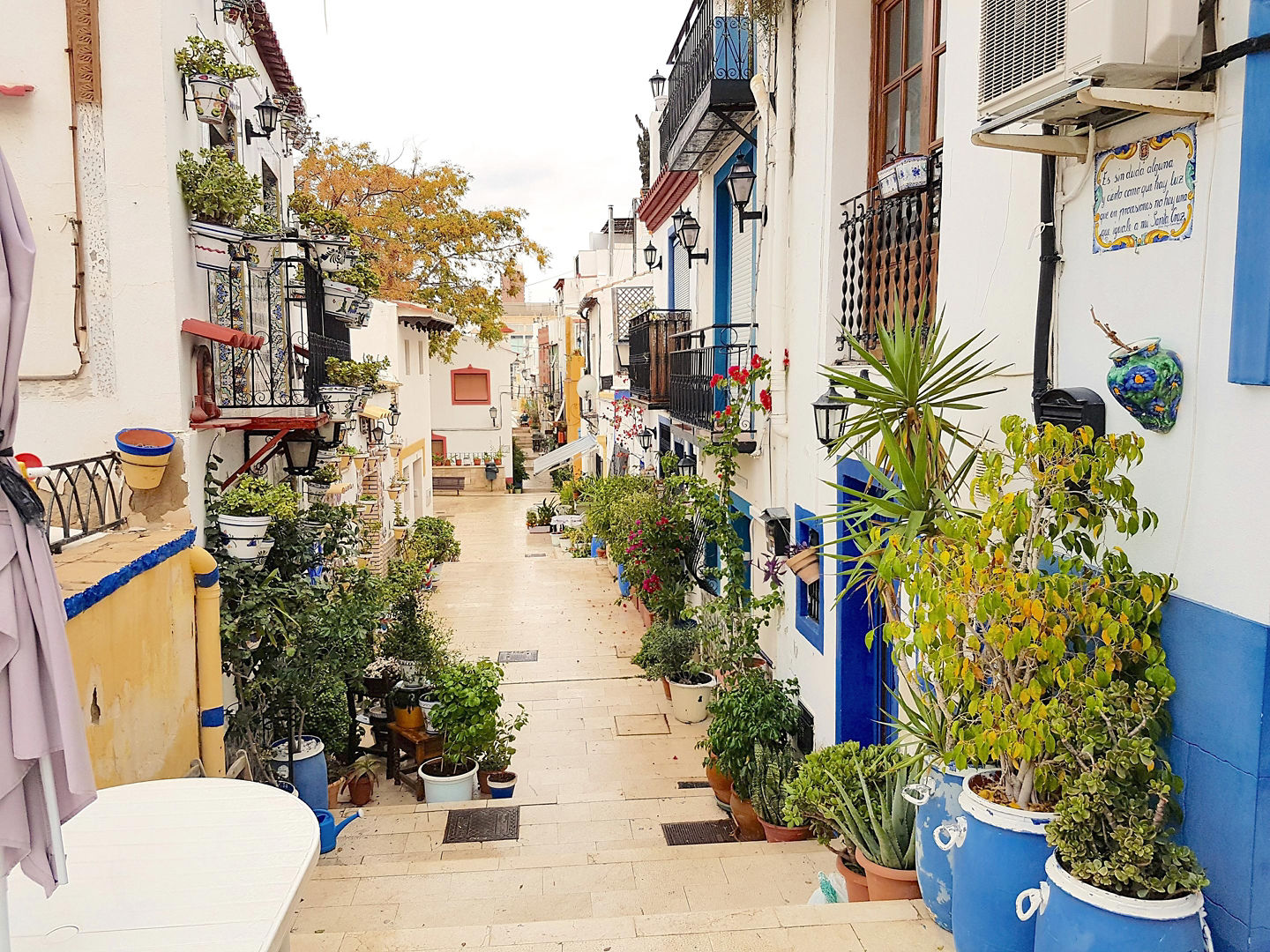 A narrow street between homes. - Alicante, Spain