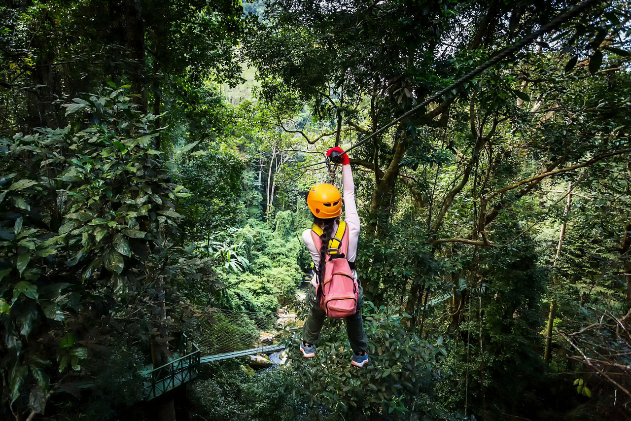 Girl Zip line  through the Jungle, Banana Coast, Honduras